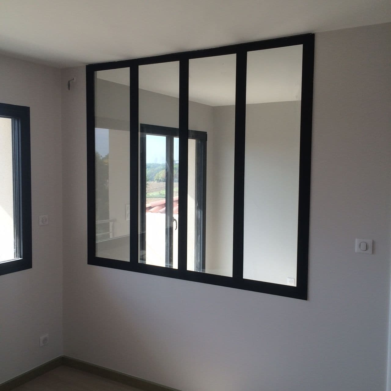 Porte vitrée en acier style verrière industrielle